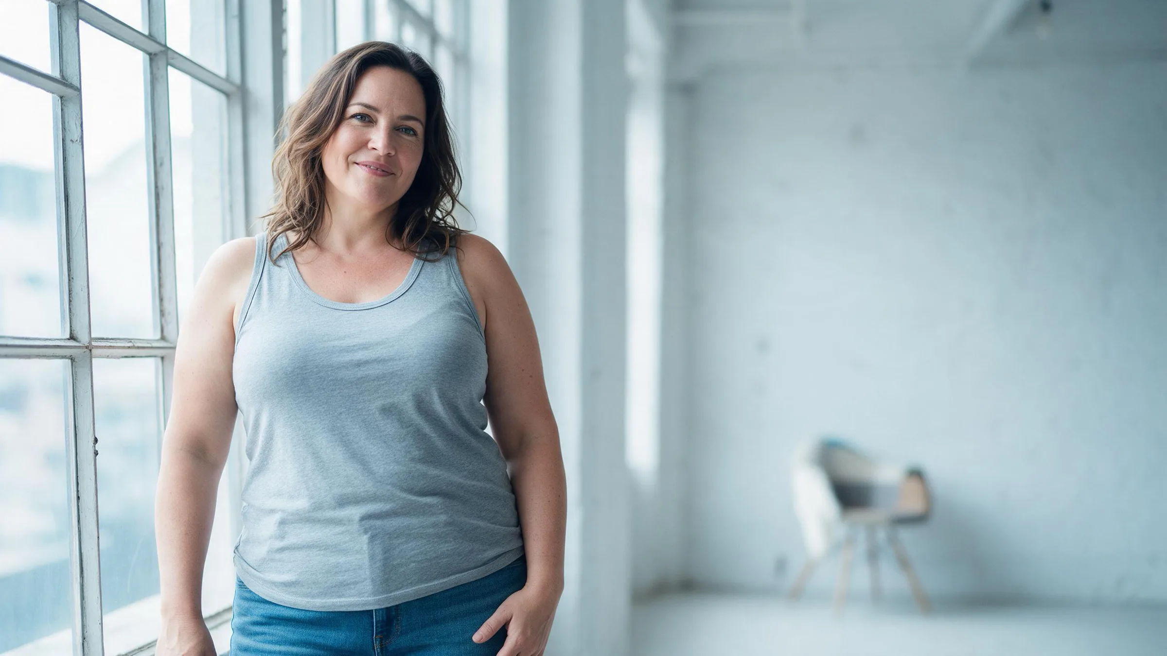 A woman standing in a bright loft